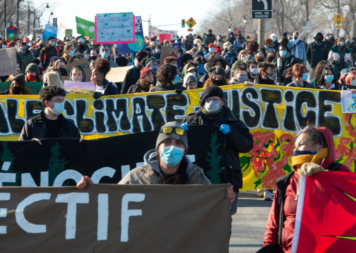 Protesters take part in a demonstration calling for climate and social justice in Montreal, Friday, March 19, 2021. 