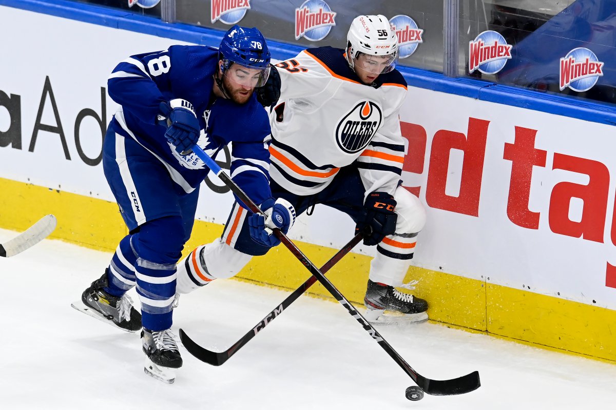 Edmonton Oilers' Mattias Ekholm (14) plays against the Toronto Maple Leafs  during the first period of