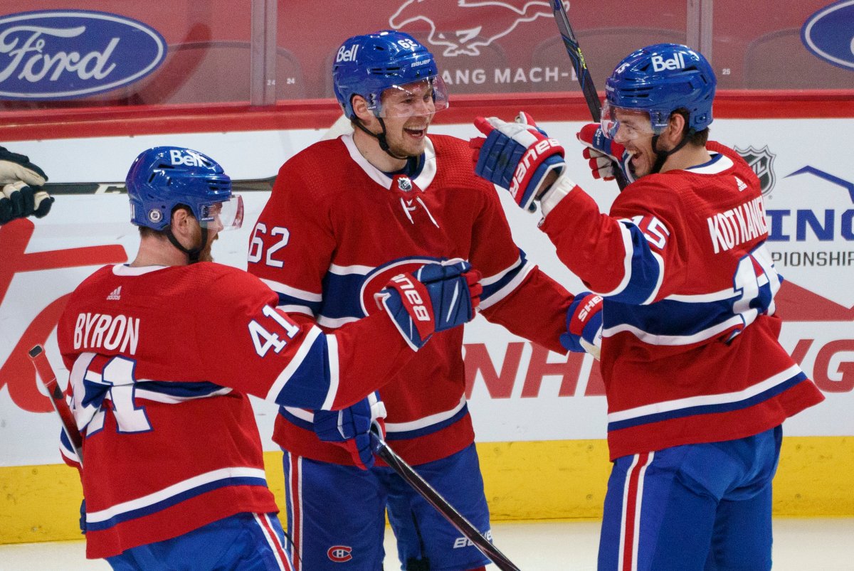 Montreal Canadiens' Jesperi Kotkaniemi, right, celebrates his goal with teammates Artturi Lehkonen, centre, and Paul Byron during first period NHL hockey action against the Edmonton Oilers, in Montreal on Tuesday, March 30, 2021. 