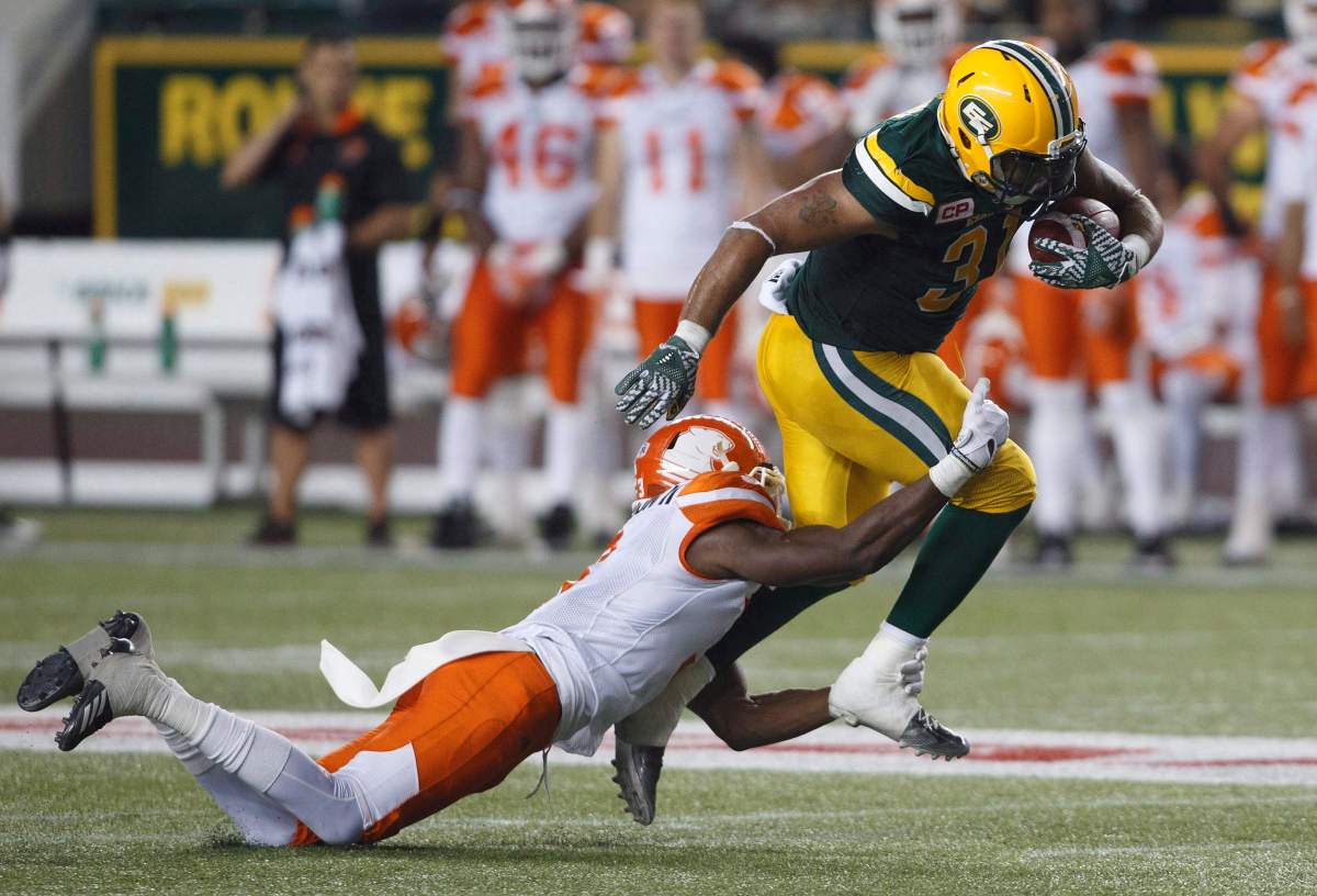 B.C. Lions defensive back Buddy Jackson (3) tackles Edmonton Eskimos fullback Calvin McCarty (31) during second half CFL action in Edmonton, Alta., on Friday, July 28, 2017.