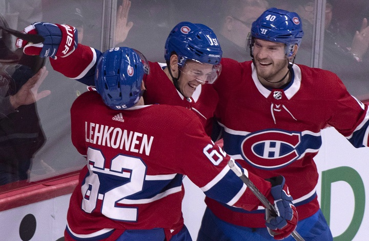 Montreal Canadiens' Jesperi Kotkaniemi, centre, celebrates his goal past Washington Capitals goaltender Braden Holtby with teammates Artturi Lehkonen, left, and Joel Armia during first period NHL hockey action in Montreal on Thursday, November 1, 2018. 