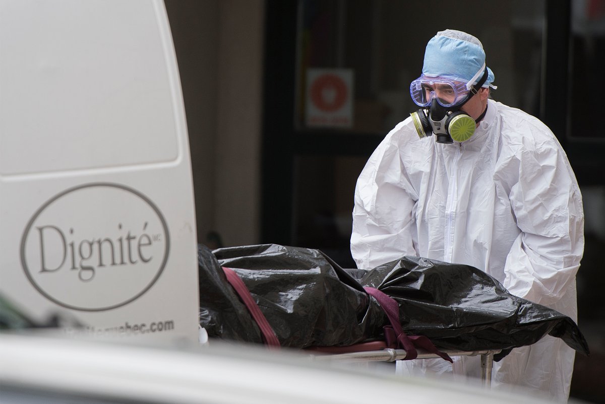 A body is removed from Maison Herron, a long term care home in the Montreal suburb of Dorval, Que., on Saturday, April 11, 2020, as COVID-19 cases rise in Canada and around the world. 