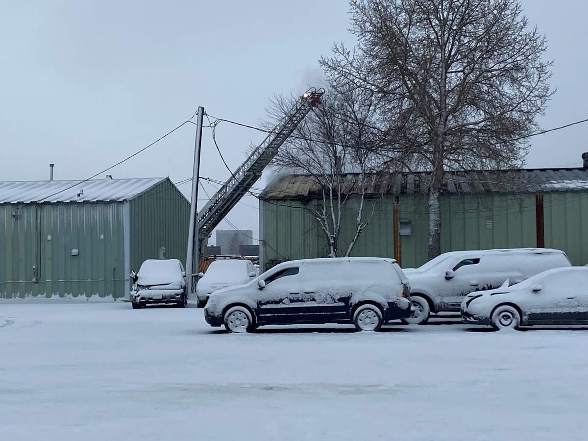Emergency crews at the scene of an industrial fire in southeast Calgary on Thursday.