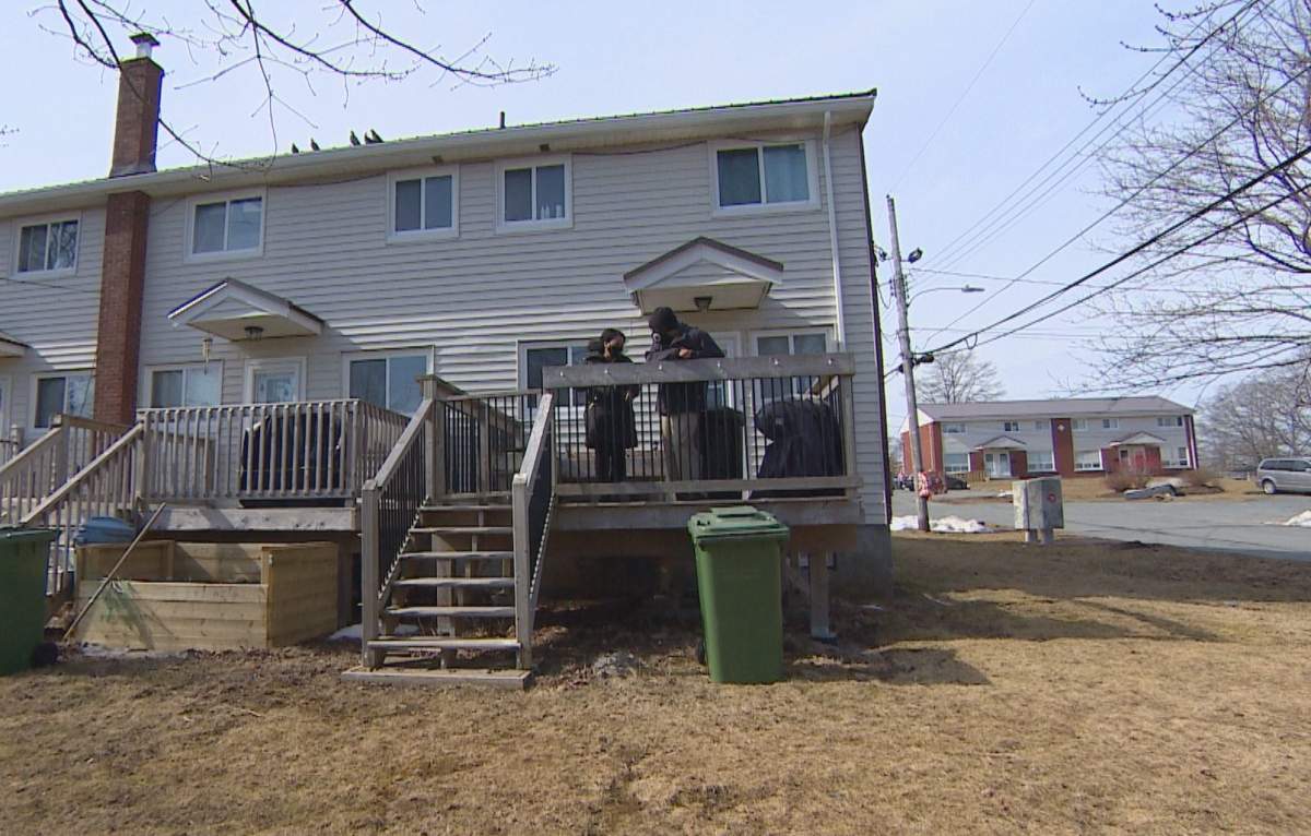 Deidra Williams and Sinclair Paynter are seen on their deck on March 11, 2021.