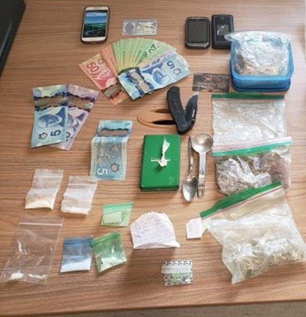 Two people were arrested and a search was conducted, which resulted in the seizure of cocaine, illegal cannabis, psilocybin, methamphetamine, LSD and Canadian cash.