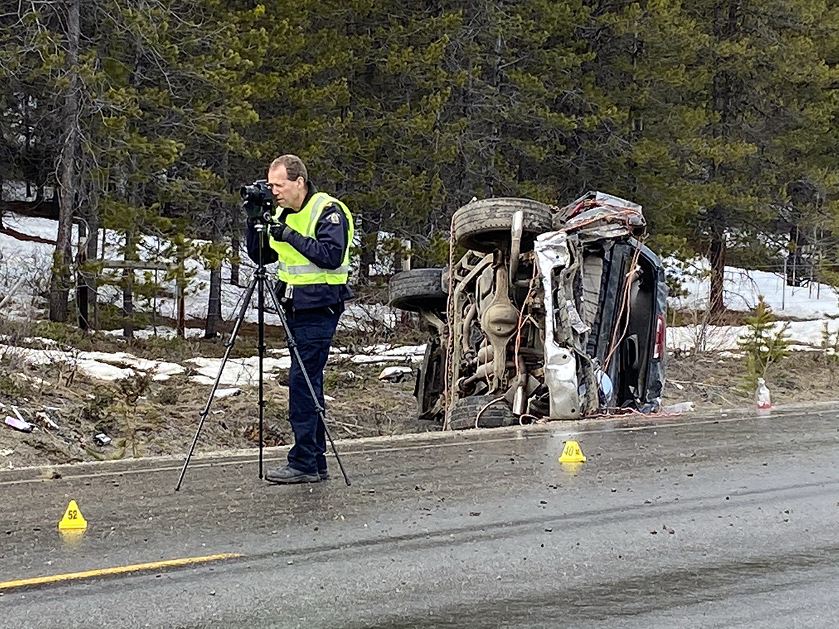 A police officer at the site of the accident on Highway 33.
