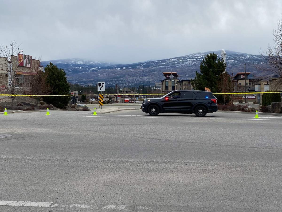 A police vehicle stationed at the Elk Road entrance to Highway 97 on Sunday morning. A stretch of the highway was closed as police investigated.