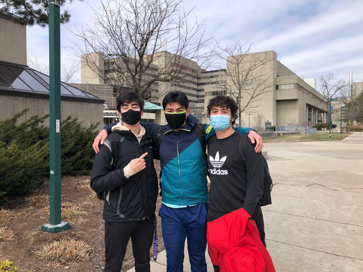 First year students Michael Mazzetti (left), Leonardo Cui (centre) and Omar Elomari have maintained a tight social bubble and follow health precautions, but worry others may not do the same.