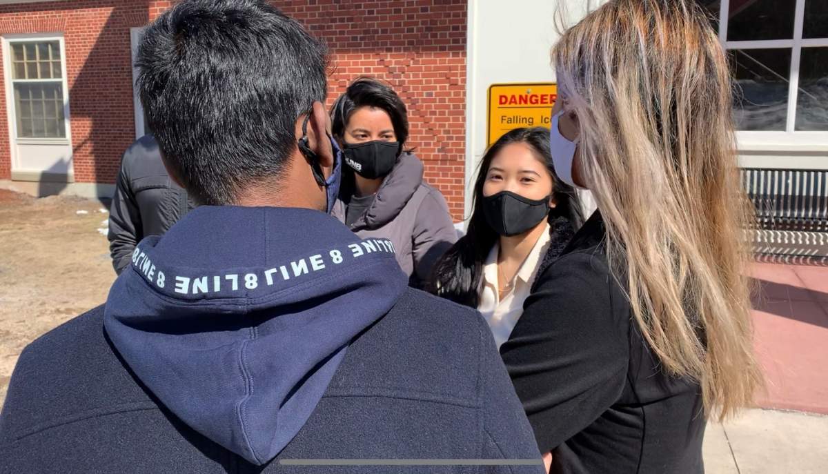 Khanh Do, Jizel Richard and fellow Asian Canadians outside the University of New Brunswick discussing the March 16th attacks in Atlanta, Georgia.