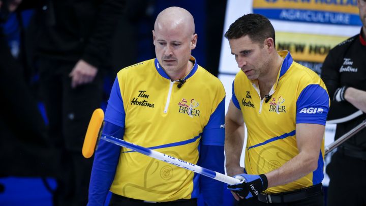 Team Wild Card Two skip Kevin Koe, left, and second John Morris discuss strategy as they play Team Ontario at the Brier in Calgary, Alta., Wednesday, March 10, 2021.