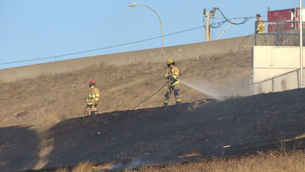 Crews battle grass fire near Max Bell arena that ‘was moving towards the bike path’ - image