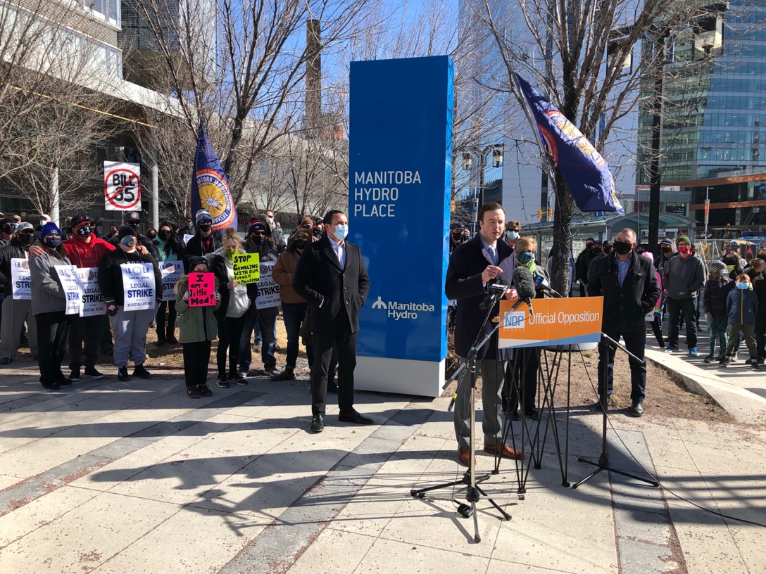 NDP members at the Manitoba Hydro building downtown standing in opposition to Bill 35.