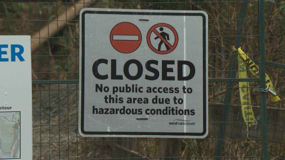 A sign warning people to stay off the Capilano Pacific Trail.