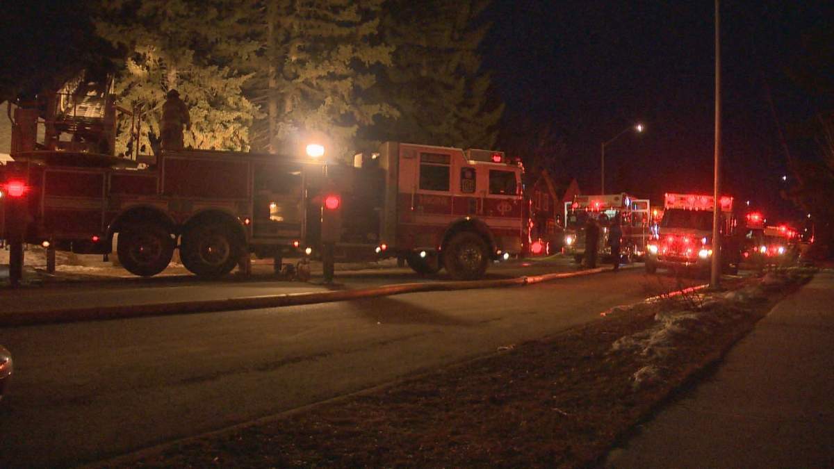 Firefighters battle a fire in the northwest early Saturday morning.