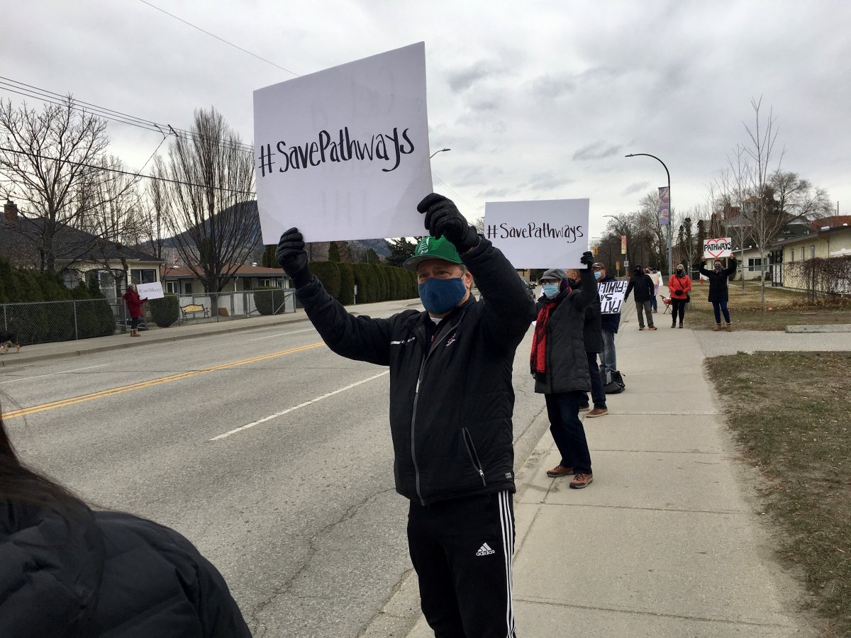 Supporters rally outside Pathways Addictions Resource Centre on Sunday, March 21, 2021.