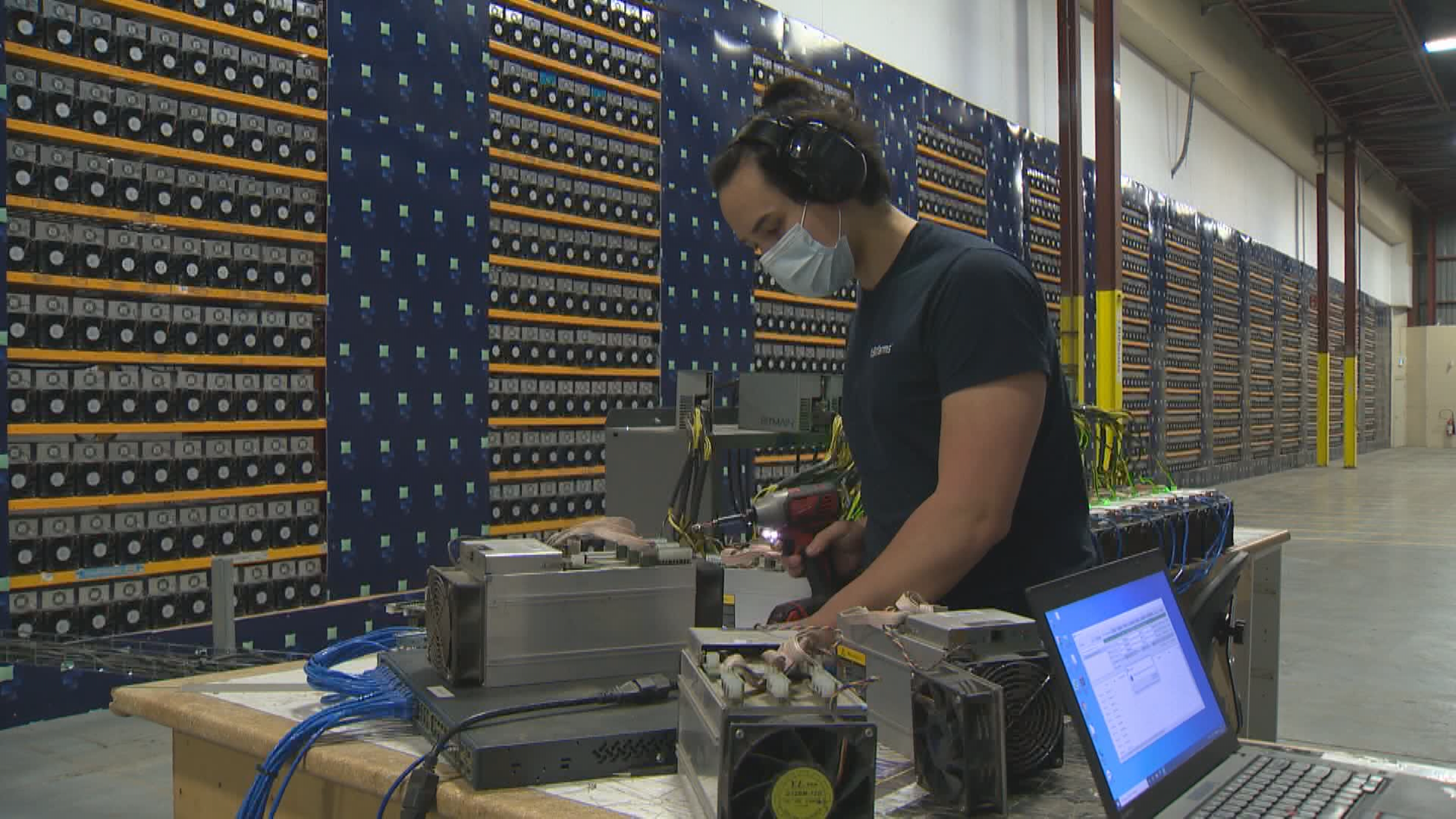 A worker at the Bitfarms cryptocurrency mining operation in Farnham, Quebec. The company has five sites in Canada.