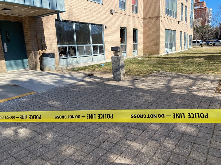 A photo of police tape surrounding an apartment building on Acorn Place in Mississauga on March 20, 2021.