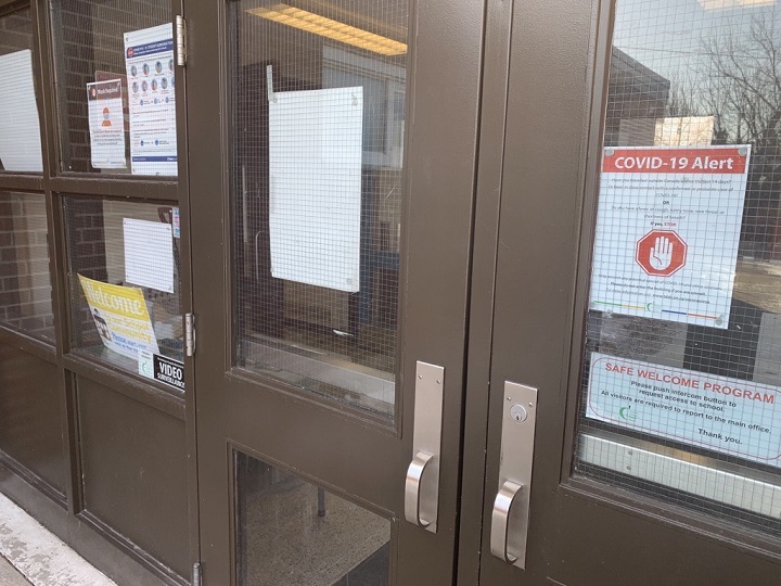 A photo of the doors of Donwood Park Public School, located in the area of Midland and Lawrence avenues.
