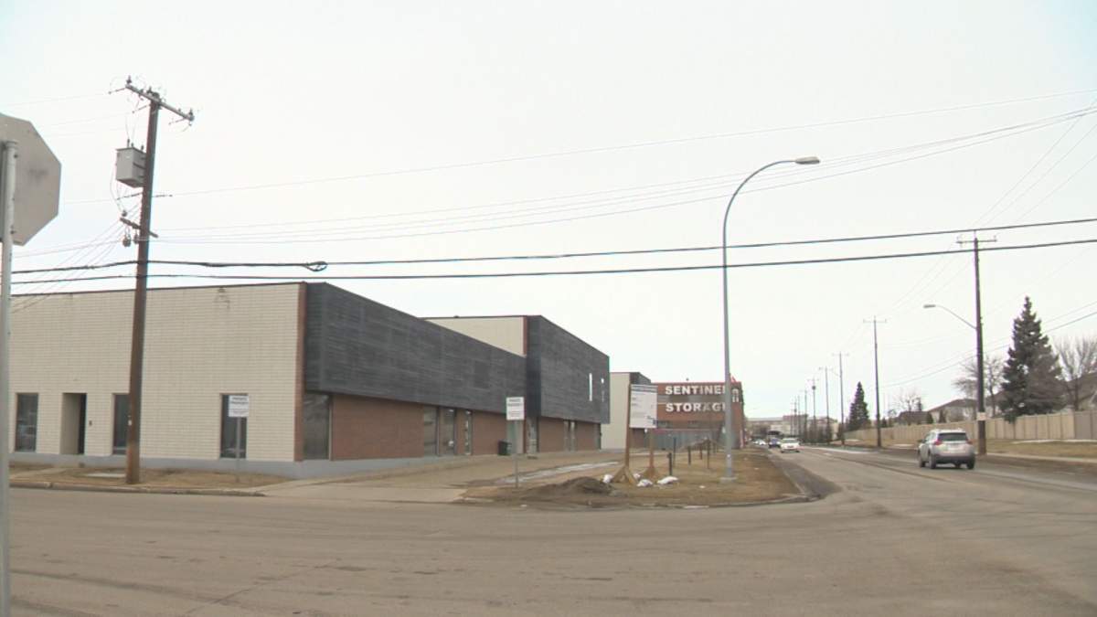 The building (left) proposed to be rezoned to allow for a crematorium. Residential homes are located across the street to the right.