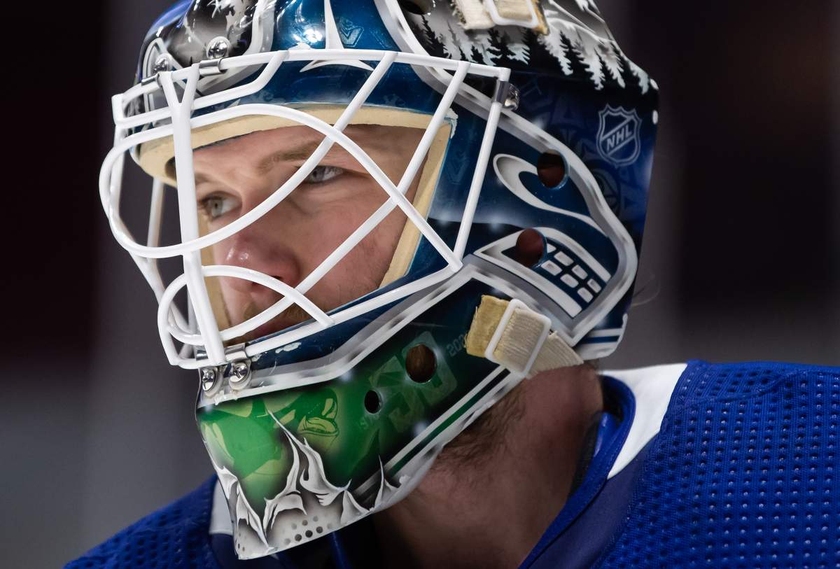 Vancouver Canucks goalie Thatcher Demko looks on during a stoppage in play during the third period of an NHL hockey game against the Edmonton Oilers in Vancouver, on Saturday, March 13, 2021.