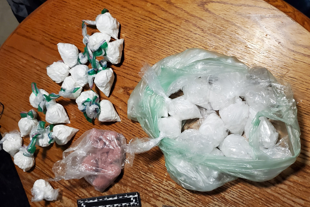 Police say they found fentanyl, meth, cocaine and oxycodone at a home in Cambridge on Friday.