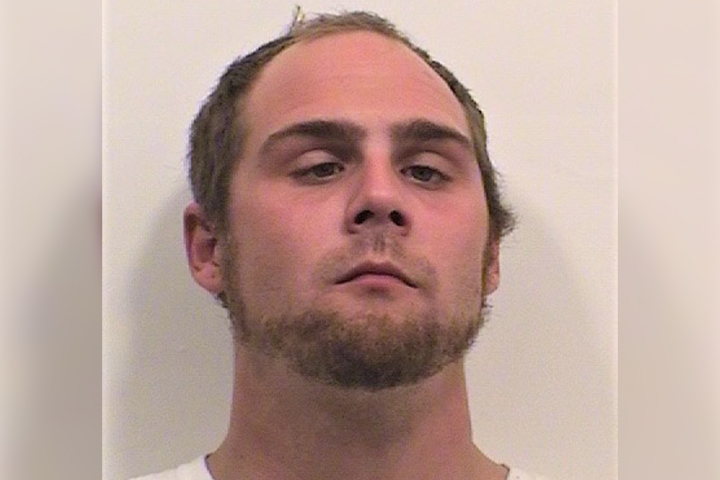 Dustin Allen Bushnell is shown in this March 2021 mugshot photo.