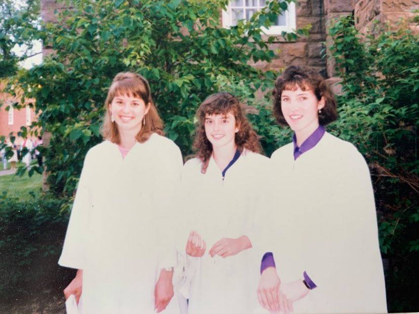 Left to right: Heidi Stevenson, Claire McIntyre, and Andrea Kiehlbauch at their high school graduation in 1989. 