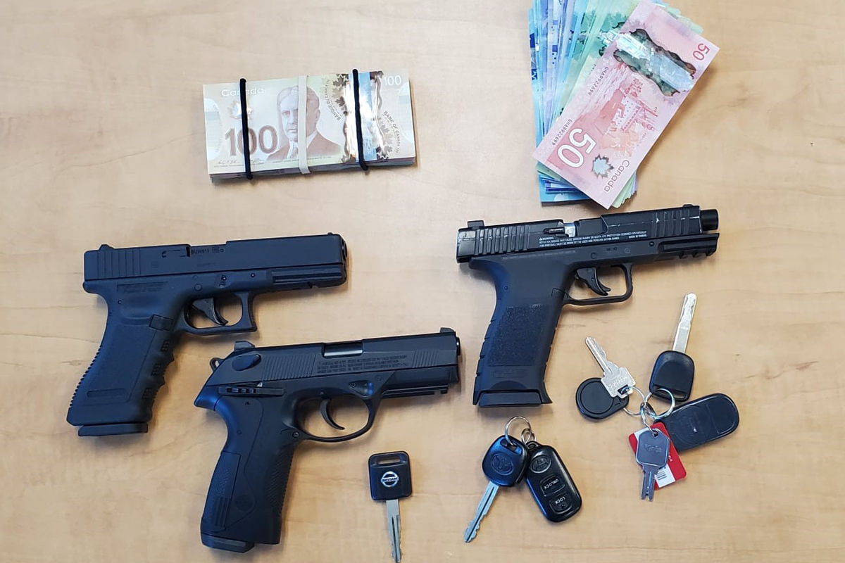 Police arrested 2 people and are looking for a third after raiding homes in Paris and Maple on Thursday.