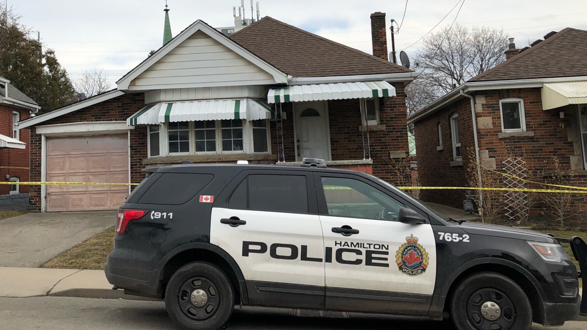 Hamilton police on location at a residence on Woodbridge Road. The bodies of two men were found inside on March 11, 2021. 