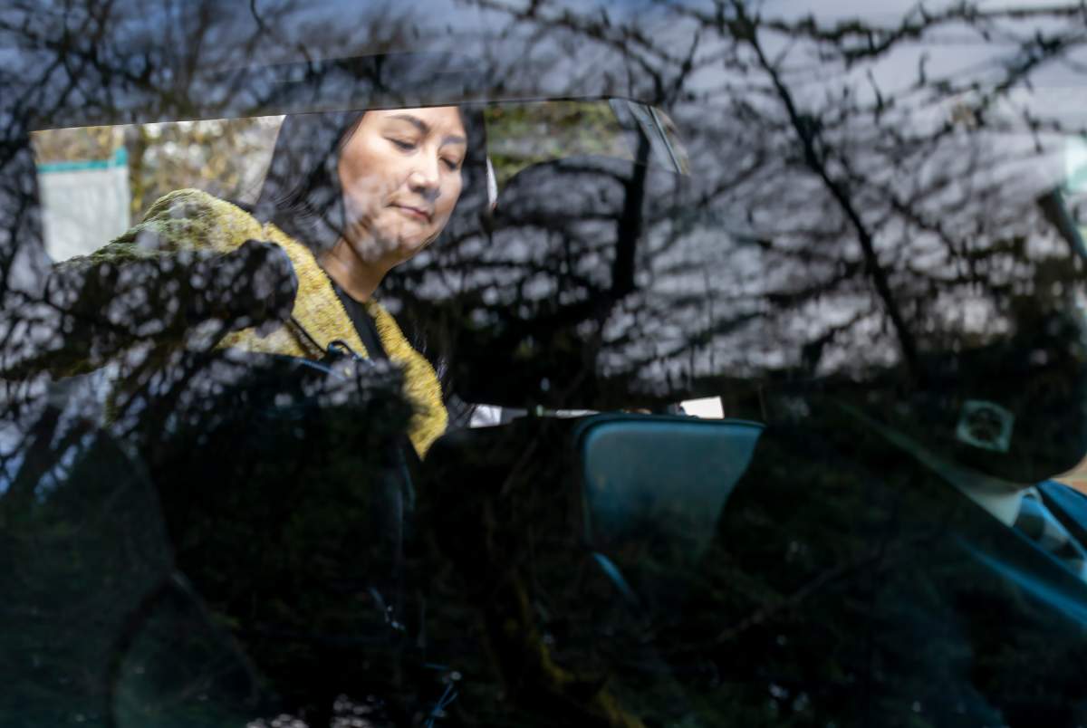 Chief Financial Officer of Huawei, Meng Wanzhou leaves her home to go to B.C. Supreme Court, in Vancouver, B.C., Friday, March 26, 2021. 