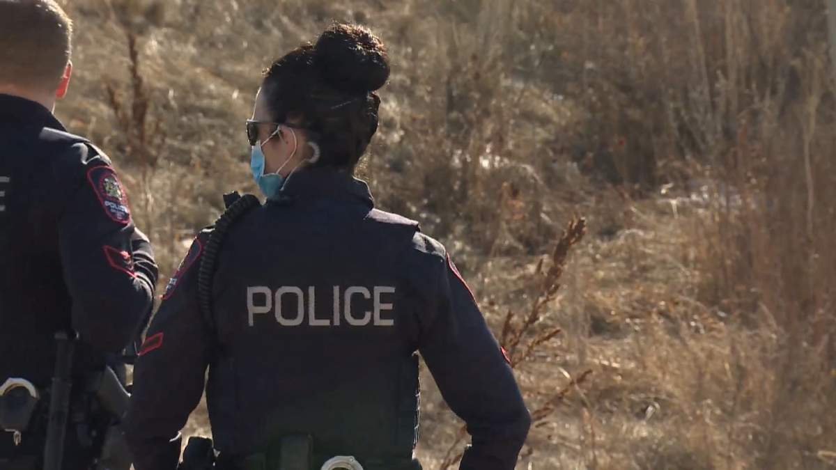 Calgary police were on scene as two bodies were recovered from the Bow River on Sunday, March 14, 2021.