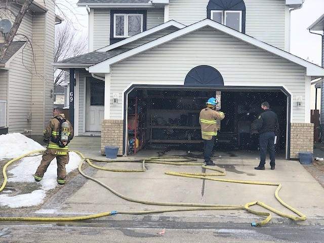 Dog saved by neighbour after Riverbend home catches fire - image