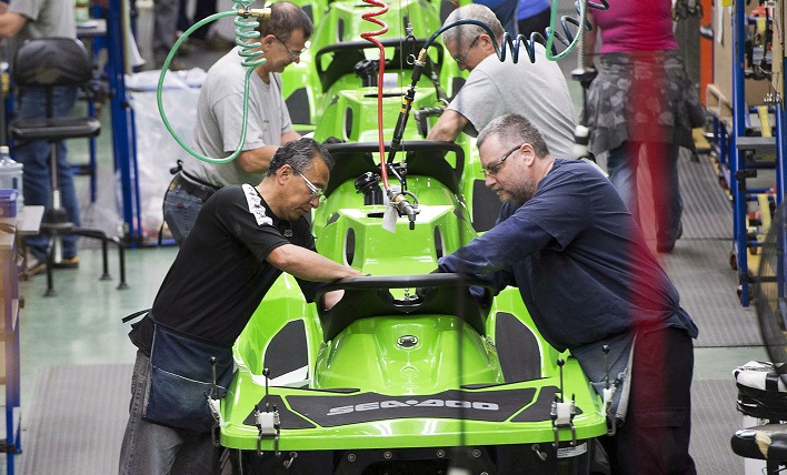 Employees work on the Sea-Doo assembly line at the BRP plant on June 12, 2014 in Valcourt, Que. 