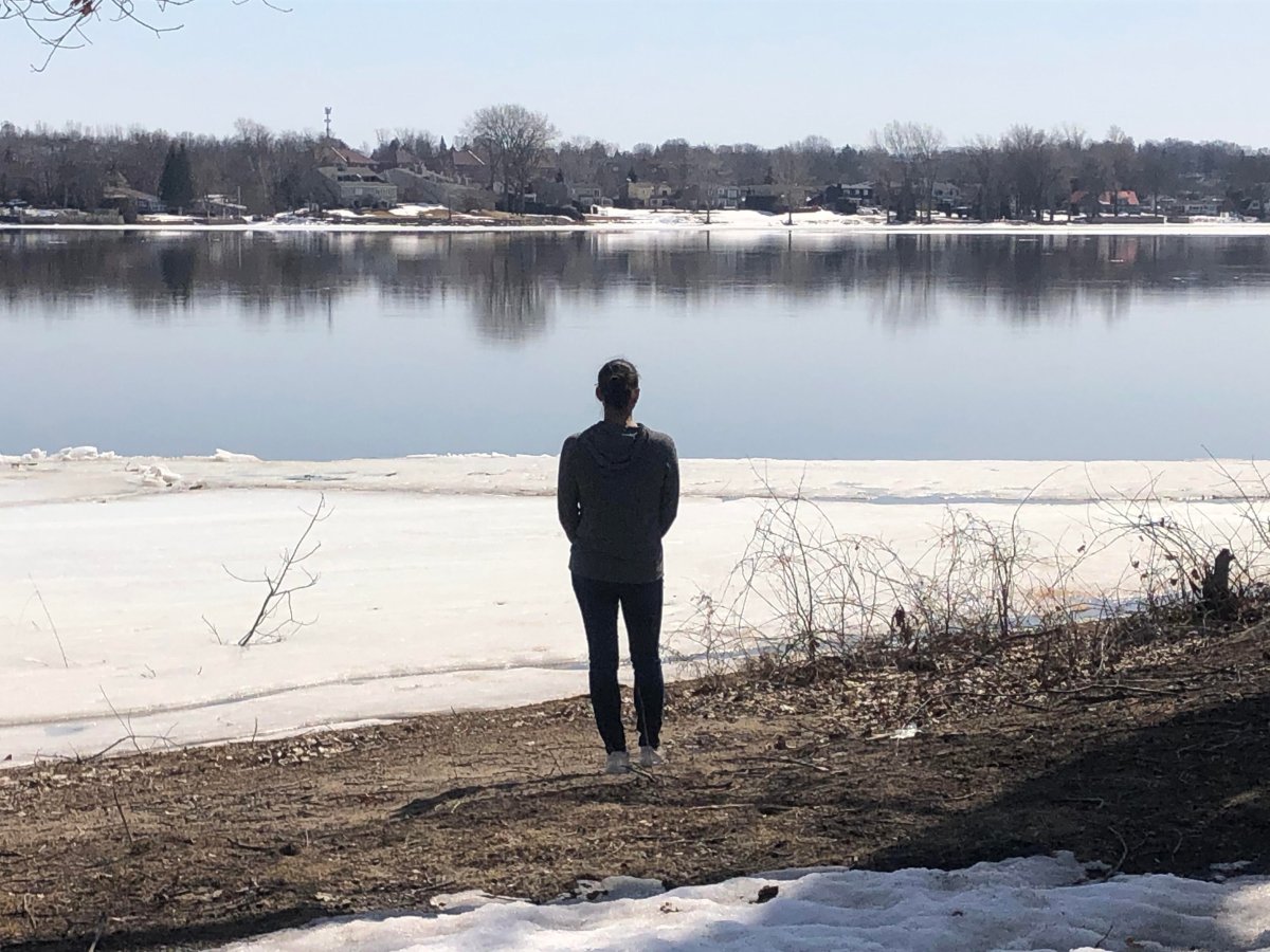 Ile-Bizard resident Genevieve Delisle checks water levels near her home daily. March 23, 2021. 