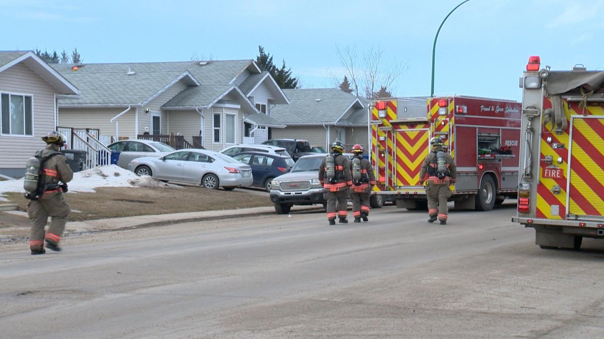 Fire crews on scene of a house fire in the Meadowgreen area Friday morning.
