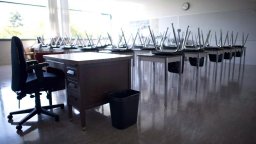 empty classroom chairs on desks