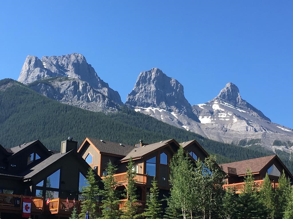 A housing development near the Three Sisters mountains on the eastern edge of Canmore, Alta., is shown on July 2, 2017. Canmore’s town council is debating the next step on two development projects that could almost double the mountain town’s population in the coming decades. THE CANADIAN PRESS/Colette Derworiz.