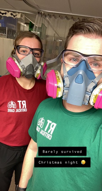 Keanna Alcock and her coworker pose for a photo following one of the busiest shifts of her career.