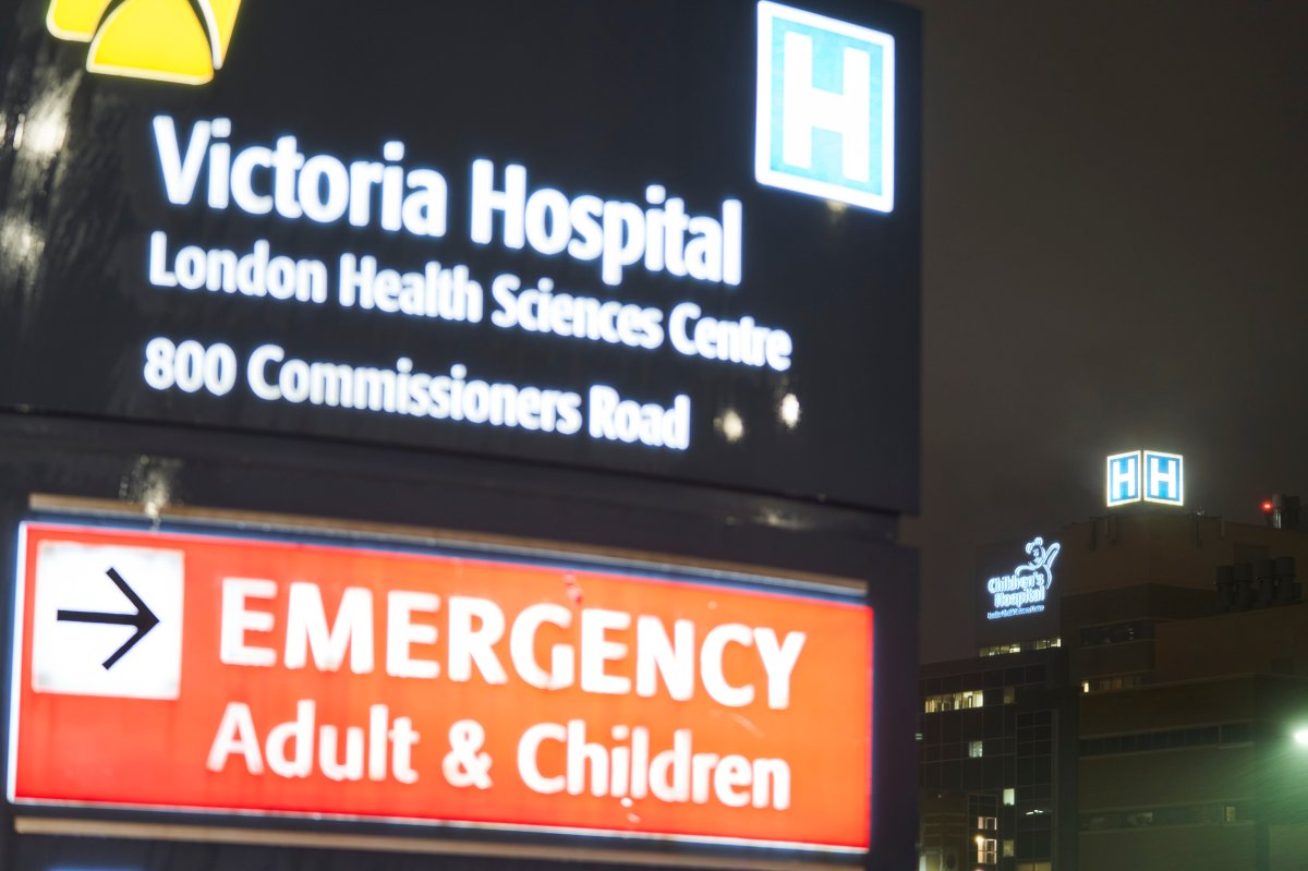 A sign outside Victoria Hospital in London, Ont. glows during evening rain on Wednesday, November 25, 2020.