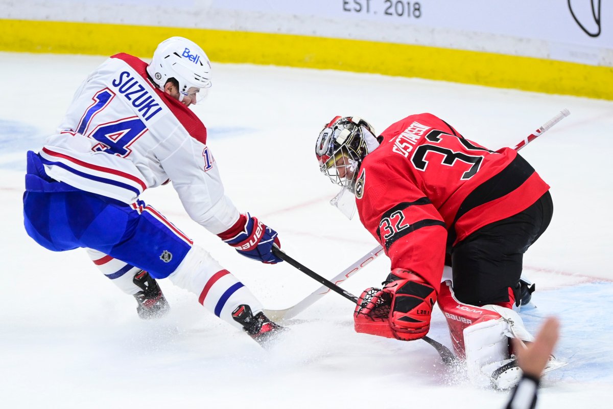 Ottawa Senators goalie Filip Gustavsson (32) stops Montreal Canadiens' Nick Suzuki (41) on a breakaway during second period NHL action in Ottawa on Thursday, April 1, 2021. 
