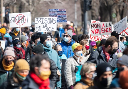 People take part in a demonstration to highlight violence against women in Montreal, Friday, April 2, 2021. THE CANADIAN PRESS/Graham Hughes