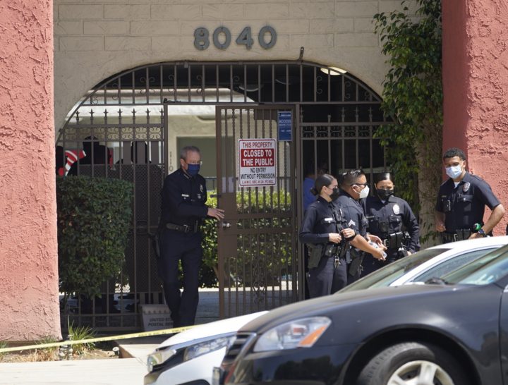 Los Angeles Police Chief Michel Moore exits an apartment complex as police investigate in Reseda, Calif., Saturday, April 10, 2021. The mother of three children — all under the age of 5 — found slain inside a Los Angeles apartment Saturday morning has been arrested, police said.  (AP Photo/Damian Dovarganes).