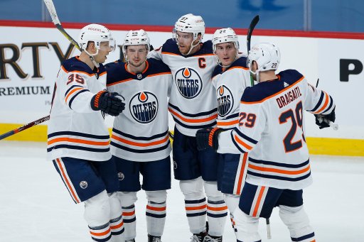 Edmonton Oilers’ Alex Chiasson (39), Kailer Yamamoto (56), Connor McDavid (97), Tyson Barrie (22) and Leon Draisaitl (29) celebrate Barrie’s goal against the Winnipeg Jets during second period NHL action in Winnipeg on Saturday, April 17, 2021.