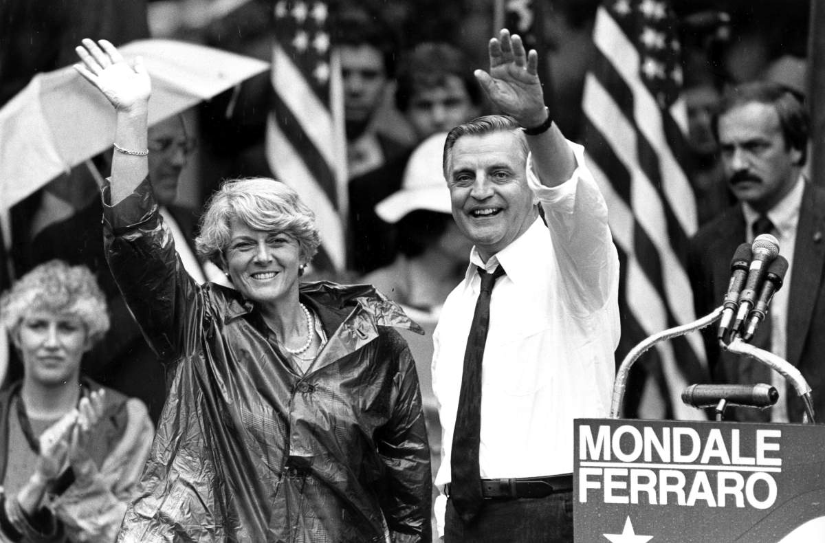 FILE – In this Wednesday, Sept. 5, 1984, file photo, Democratic presidential candidate Walter Mondale and his running mate, Geraldine Ferraro, wave as they leave an afternoon rally in Portland, Ore. Mondale, a liberal icon who lost the most lopsided presidential election after bluntly telling voters to expect a tax increase if he won, died Monday, April 19, 2021. He was 93. (AP Photo/Jack Smith, File)