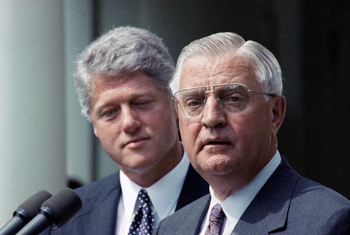FILE – In this June 1993 file photo, President Bill Clinton stands behind his nominee for Ambassador to Japan, former Vice President Walter Mondale. Mondale, a liberal icon who lost the most lopsided presidential election after bluntly telling voters to expect a tax increase if he won, died Monday, April 19, 2021. He was 93. (AP Photo/Greg Gibson, File)