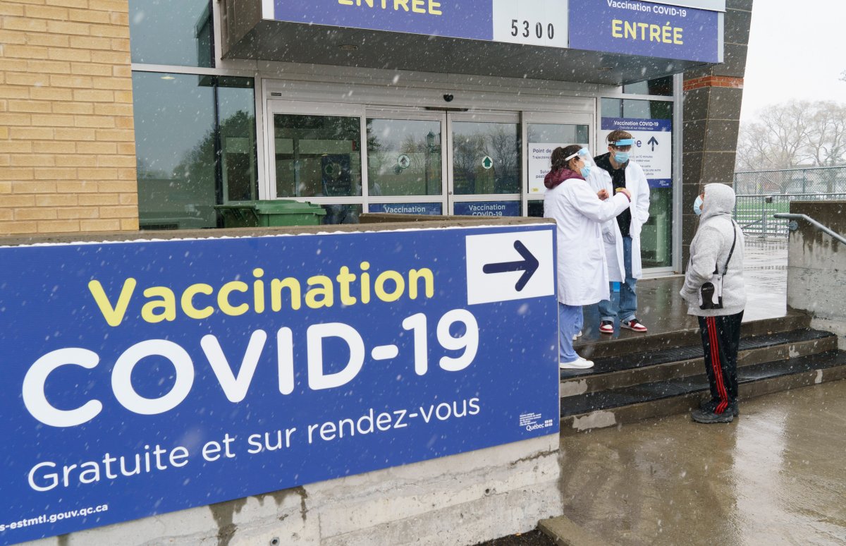 A man is screened before entering a COVID-19 vaccination clinic in Montreal, on Wednesday, April 21, 2021.