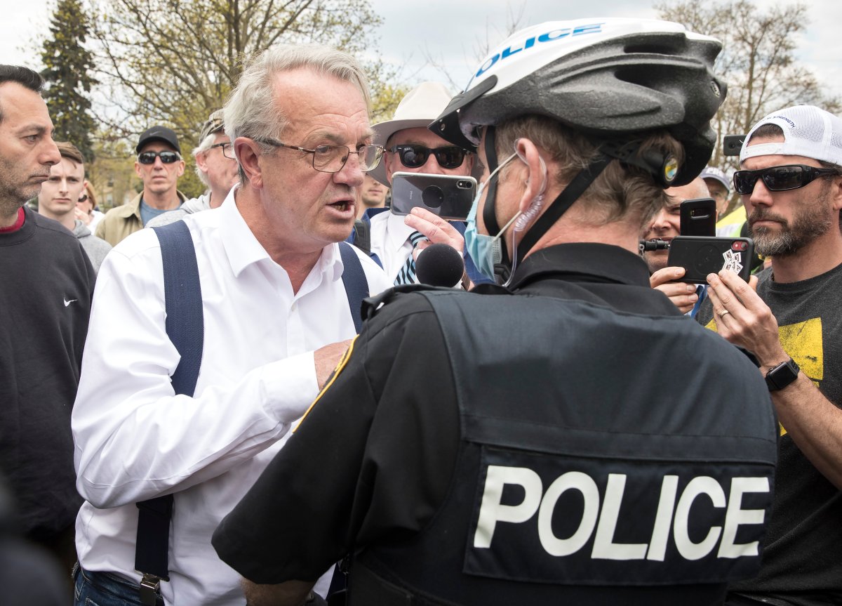 Randy Hillier, independent MPP for Lanark-Frontenac-Kingston argues with Peterborough Police Service Chief Scott Gilbert at an anti-lockdown protest against government measures to curb the spread of COVID-19, in Peterborough, Ont., Saturday, April 24, 2021. Hillier received a ticket and a summons to appear in court for violating the province's stay-at-home-order. 