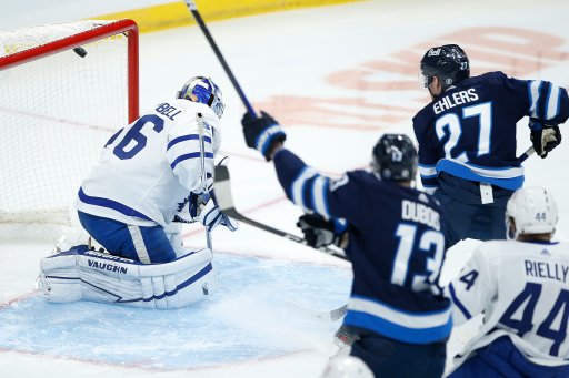 Winnipeg Jets’ Nikolaj Ehlers (27) scores on Toronto Maple Leafs goaltender Jack Campbell (36) during first period NHL action in Winnipeg on Saturday, April 24, 2021. THE CANADIAN PRESS/John Woods