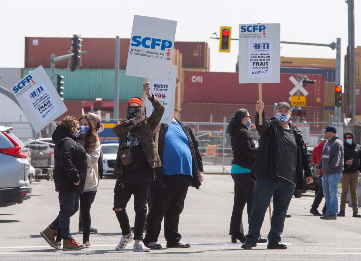 Port of Montreal workers picket on the second day of their strike Tuesday, April 27, 2021 in Montreal.