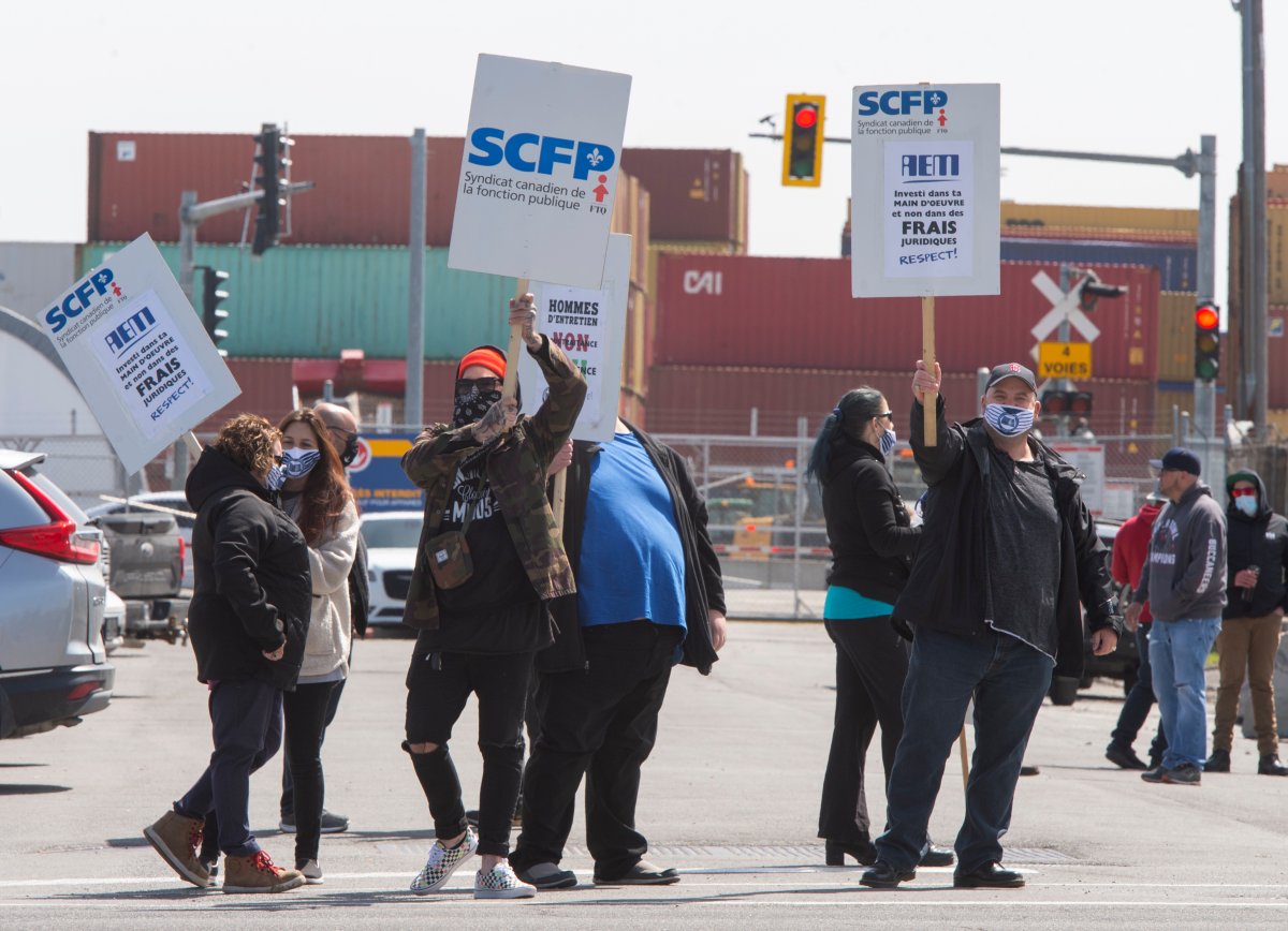 Port of Montreal workers picket on the second day of their strike Tuesday, April 27, 2021 in Montreal.
